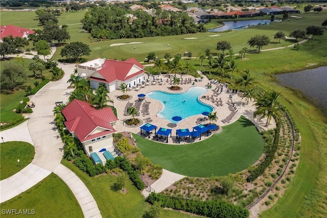 birds eye view of property with a water view and golf course view