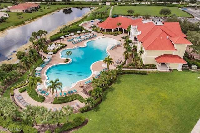 birds eye view of property with a water view