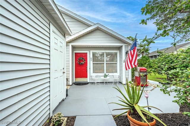 doorway to property with a patio