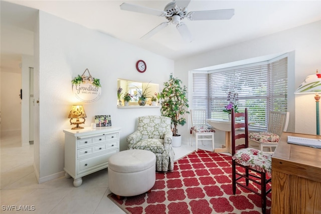 1311 Monarch Cir, Naples, FL 34116 - sitting room with light tile patterned floors and ceiling fan