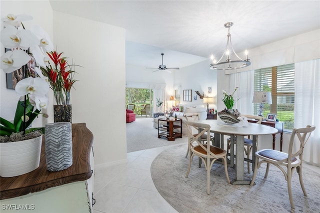 1311 Monarch Cir, Naples, FL 34116 - dining room with a chandelier, ceiling fan, and light tile patterned floors