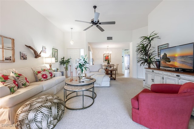 living room with ceiling fan and light colored carpet