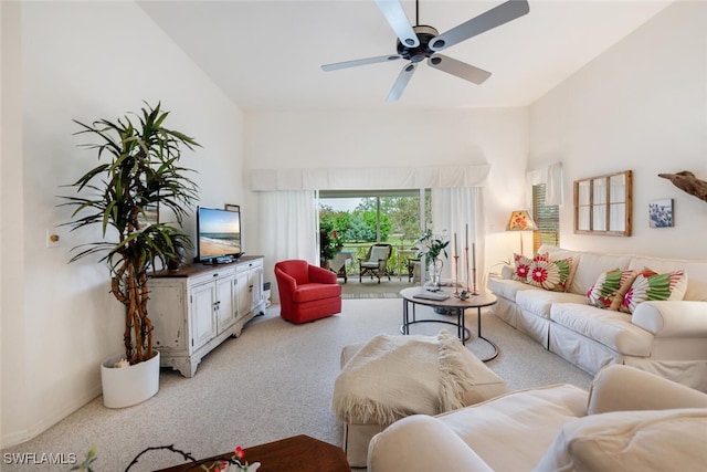 carpeted living room featuring ceiling fan