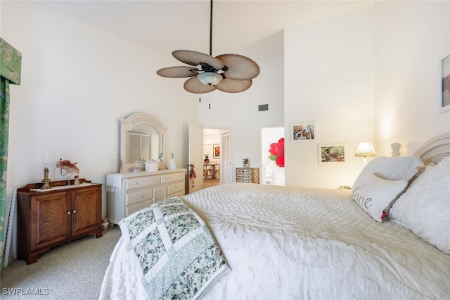 bedroom featuring ceiling fan, light colored carpet, and high vaulted ceiling