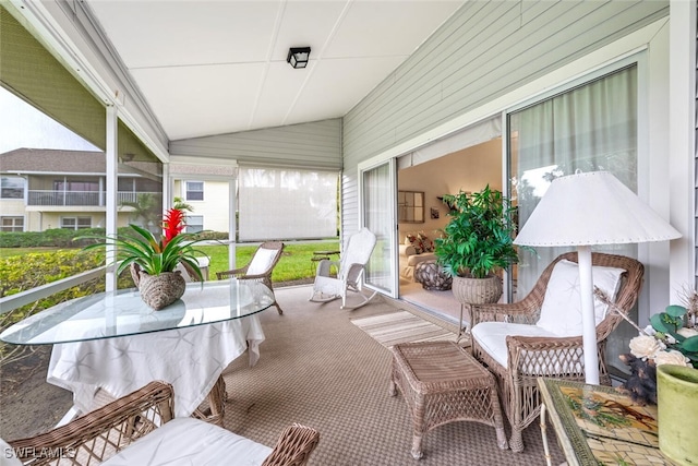 sunroom / solarium with vaulted ceiling