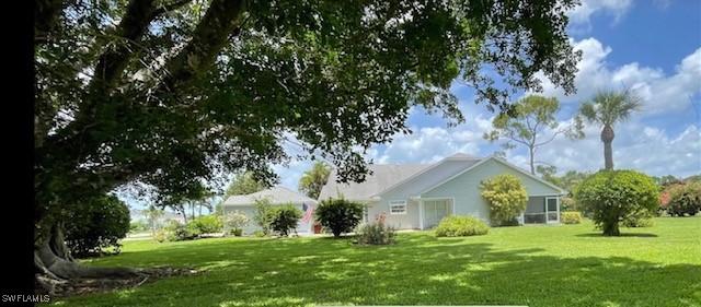 1311 Monarch Cir, Naples, FL 34116 - view of grassy yard