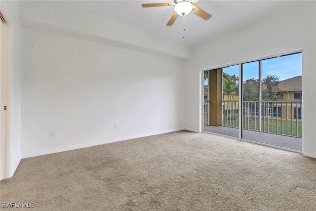 unfurnished room featuring ceiling fan and carpet flooring