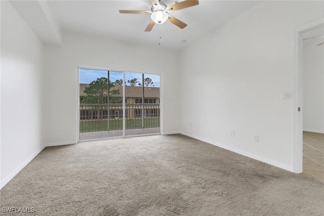 unfurnished room with ceiling fan and carpet