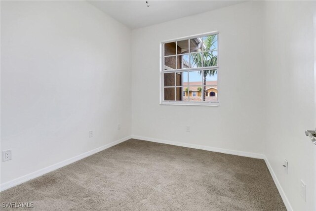 empty room with carpet flooring