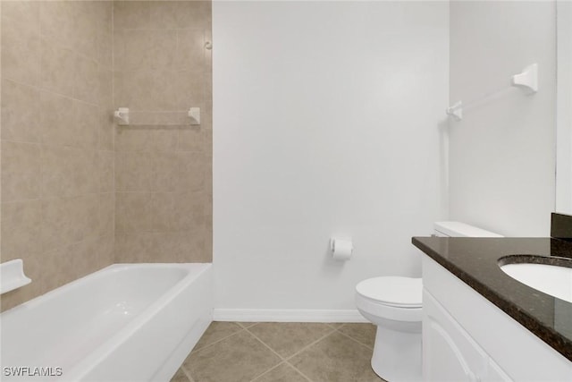 full bathroom with toilet, tile patterned flooring, tiled shower / bath, and vanity