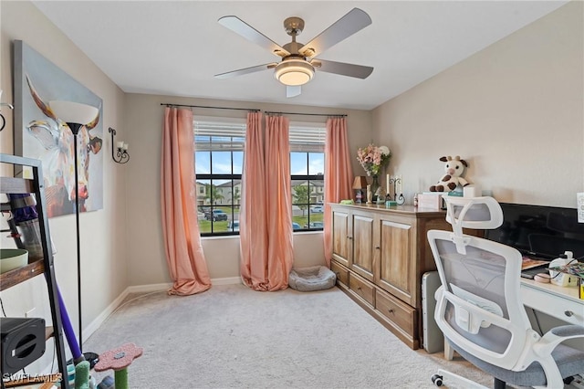 home office featuring carpet and ceiling fan