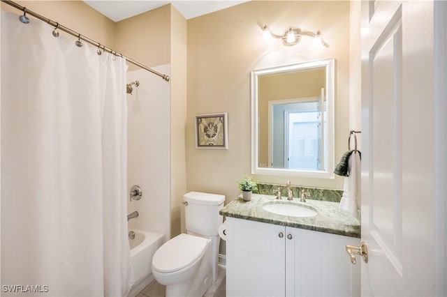 bathroom featuring shower / bath combo with shower curtain, toilet, and vanity