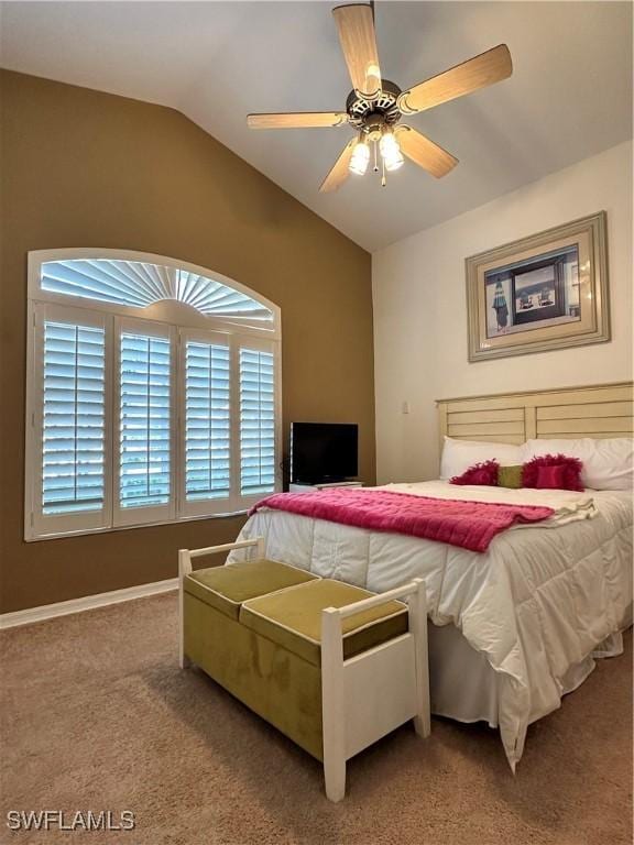 bedroom with ceiling fan, carpet, and lofted ceiling