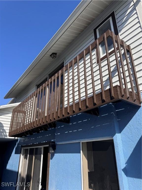 view of side of home featuring a balcony