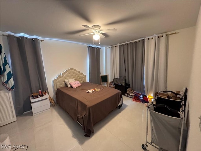 bedroom featuring ceiling fan and light tile patterned floors