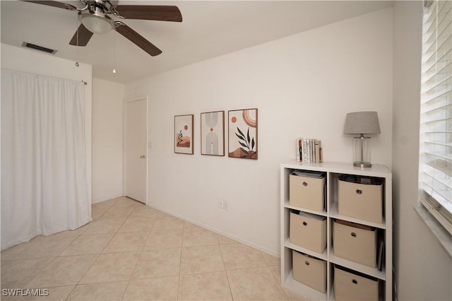 interior space featuring ceiling fan