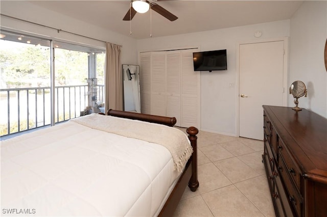 bedroom with a closet, light tile patterned floors, access to outside, and ceiling fan