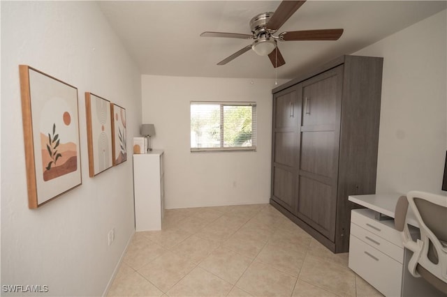 office area featuring ceiling fan and light tile patterned floors