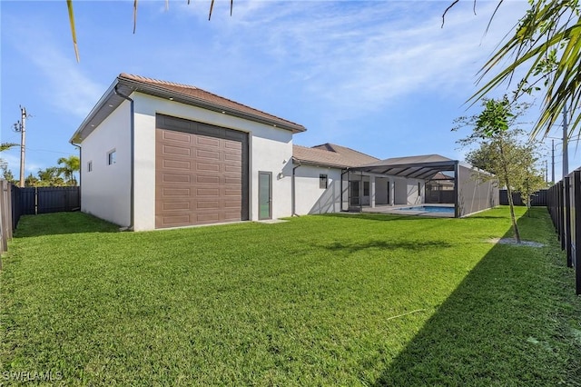 back of property with a lawn, a fenced in pool, and glass enclosure