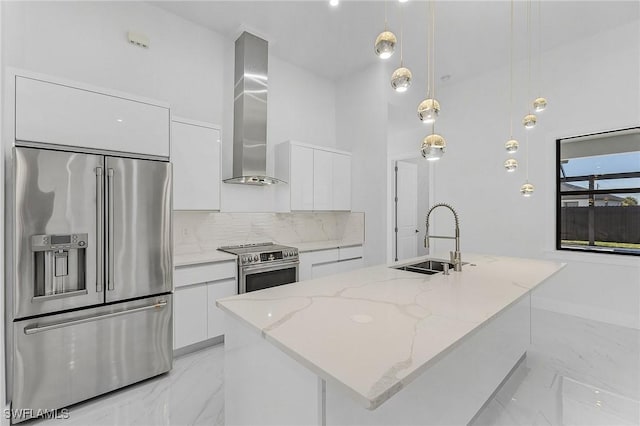 kitchen featuring an island with sink, white cabinets, appliances with stainless steel finishes, and sink