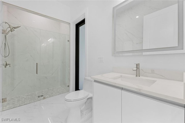 bathroom with toilet, vanity, and walk in shower