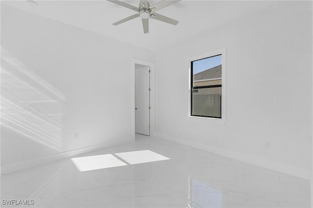 empty room featuring ceiling fan