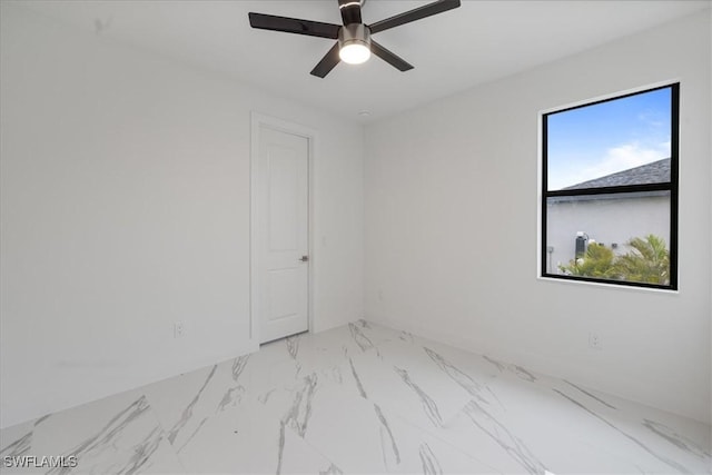 spare room featuring ceiling fan