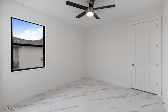 spare room with ceiling fan