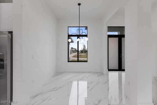 unfurnished dining area featuring french doors