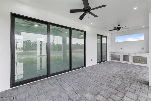 view of patio / terrace featuring ceiling fan