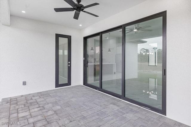 view of patio with ceiling fan