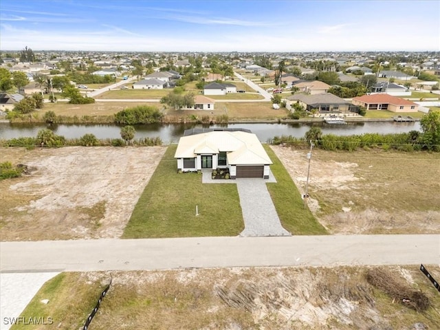 drone / aerial view with a water view