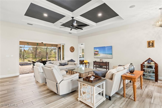 living room with ceiling fan with notable chandelier, a high ceiling, coffered ceiling, and wood tiled floor