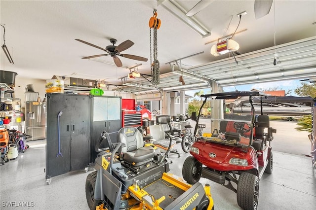 garage featuring a garage door opener and ceiling fan