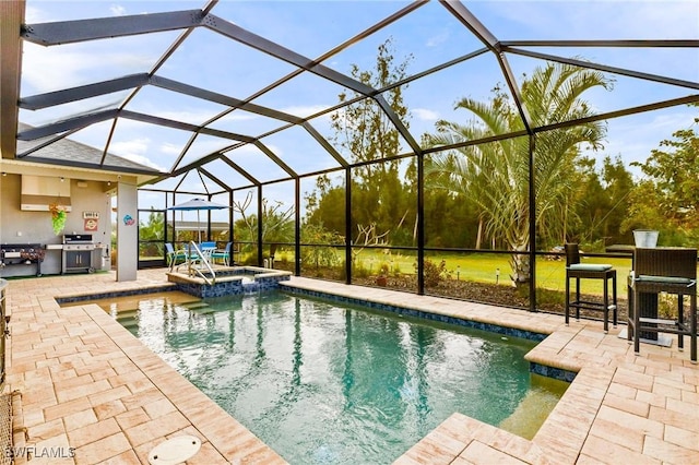 view of swimming pool featuring area for grilling, a patio area, a lanai, and a pool with connected hot tub