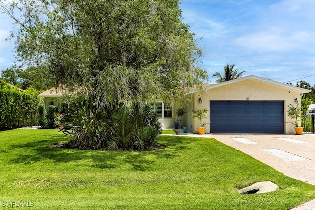 view of front of house with a front lawn and a garage