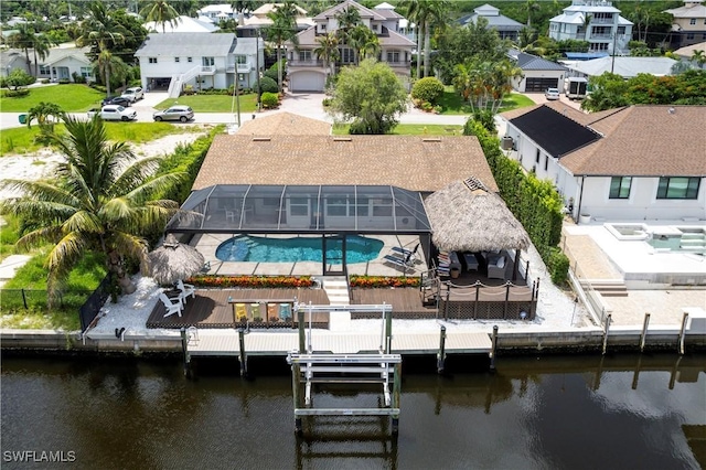 birds eye view of property with a water view