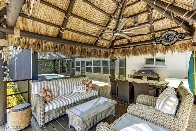 sunroom / solarium featuring beamed ceiling