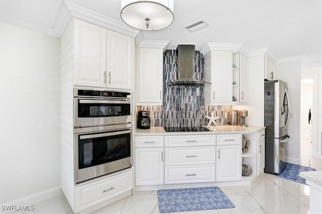 kitchen featuring stainless steel appliances, wall chimney exhaust hood, and white cabinetry