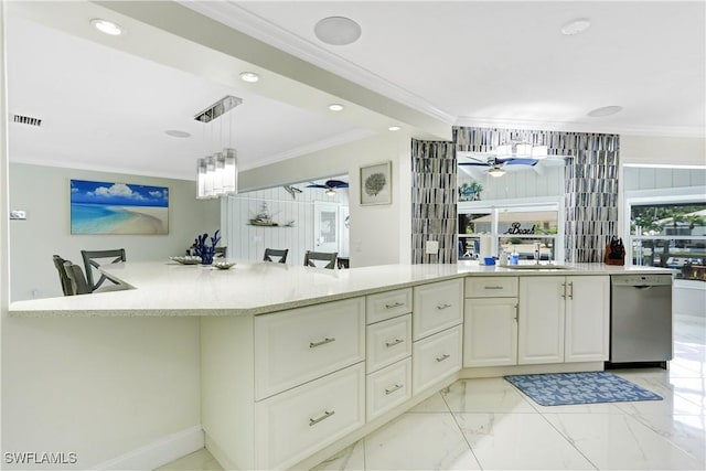 kitchen featuring sink, hanging light fixtures, dishwasher, and ornamental molding