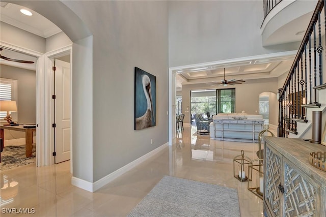 hallway with crown molding and coffered ceiling