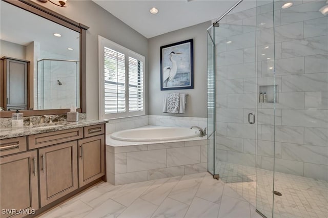 bathroom featuring vanity and plus walk in shower