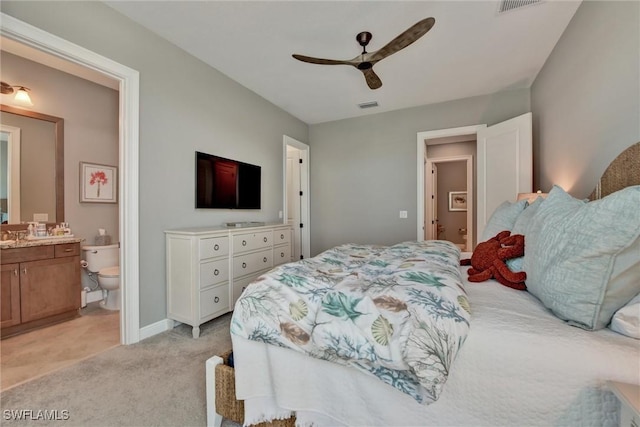 carpeted bedroom with ceiling fan and connected bathroom