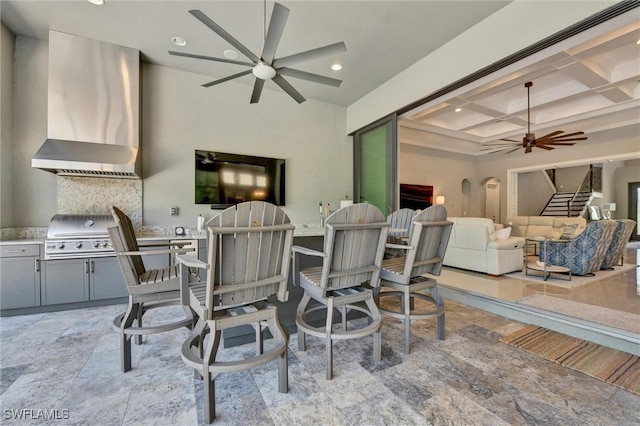 dining area featuring beam ceiling and coffered ceiling