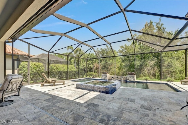 view of patio / terrace featuring glass enclosure and a pool with hot tub