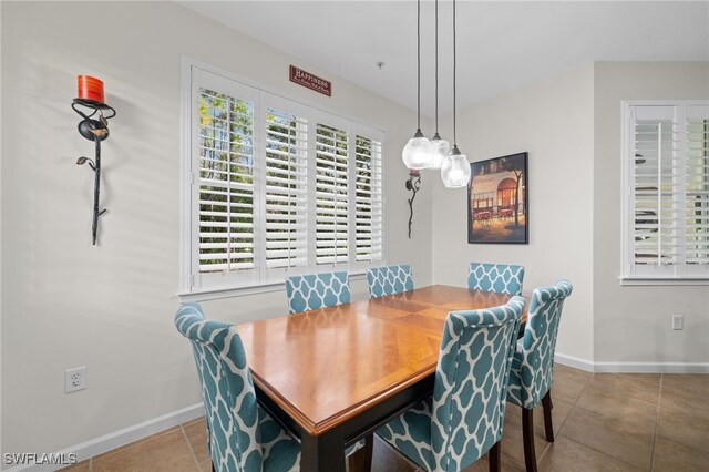 dining space with light tile patterned floors