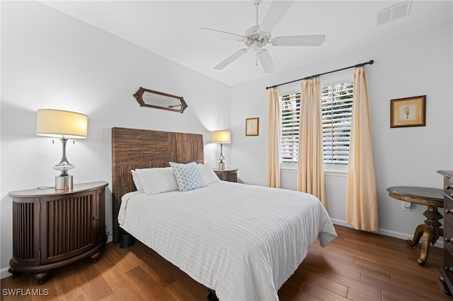 bedroom with ceiling fan and dark hardwood / wood-style flooring