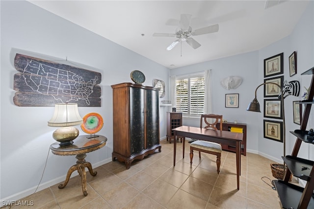 tiled home office with ceiling fan