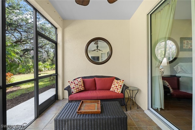 sunroom / solarium with ceiling fan