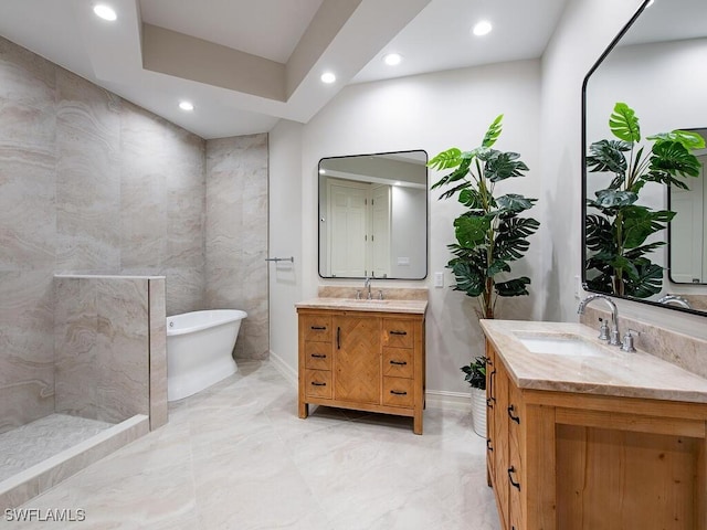 bathroom with vanity and a bathing tub